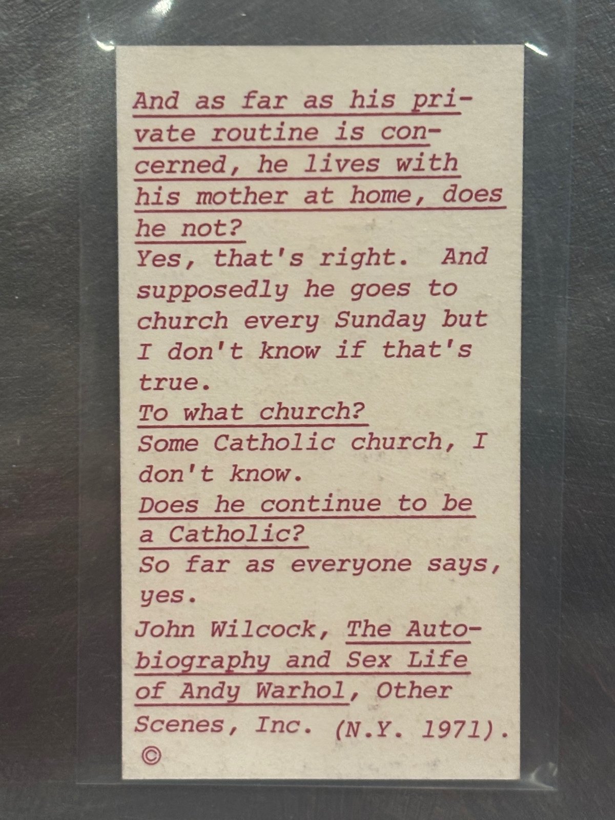 Back of the Warhol card: a typed red interview excerpt about Warhol living with his mother and going to church, credited to John Wilcock, The Autobiography and Sex Life of Andy Warhol, Other Scenes, 1971.